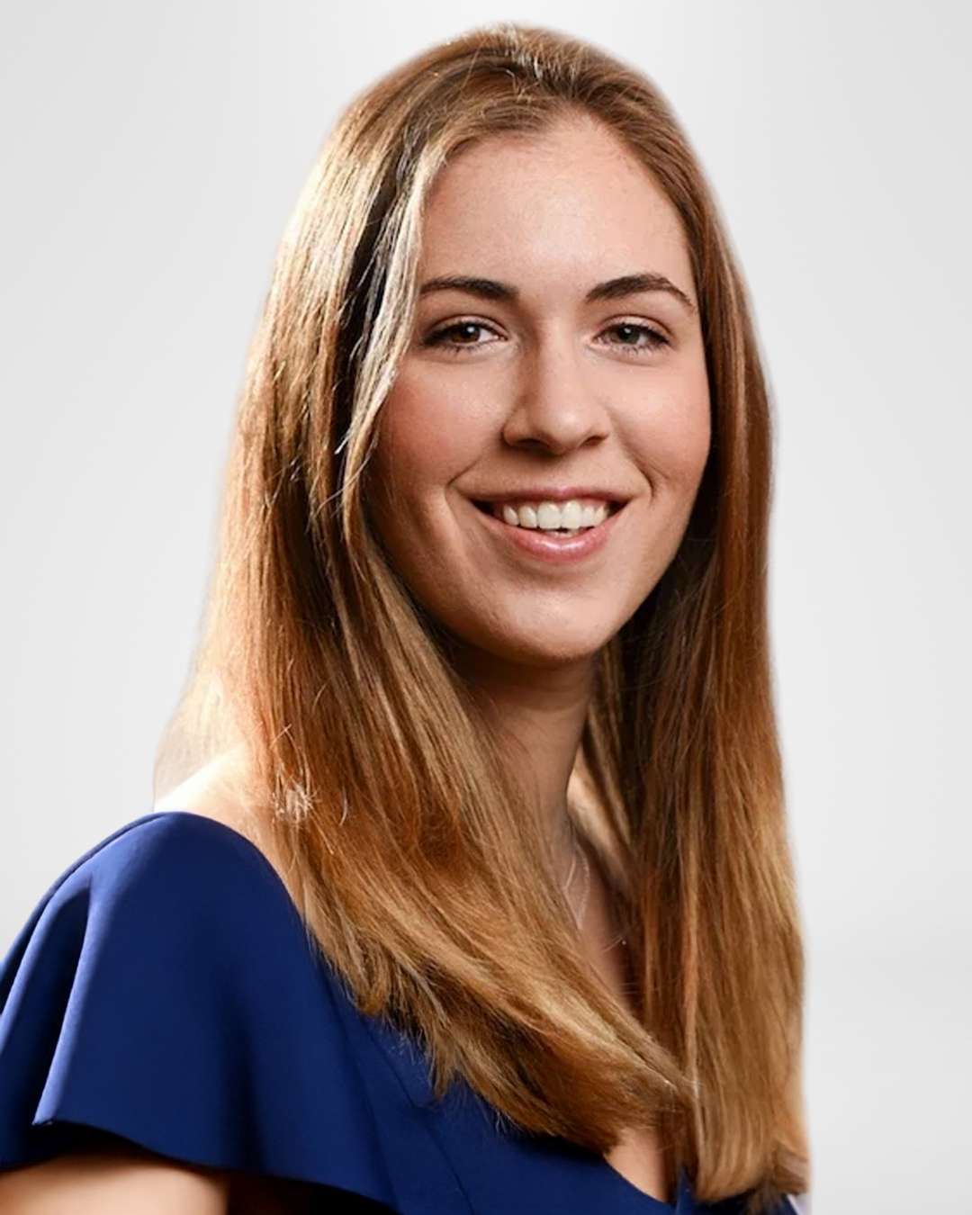 Smiling woman with long hair in blue dress