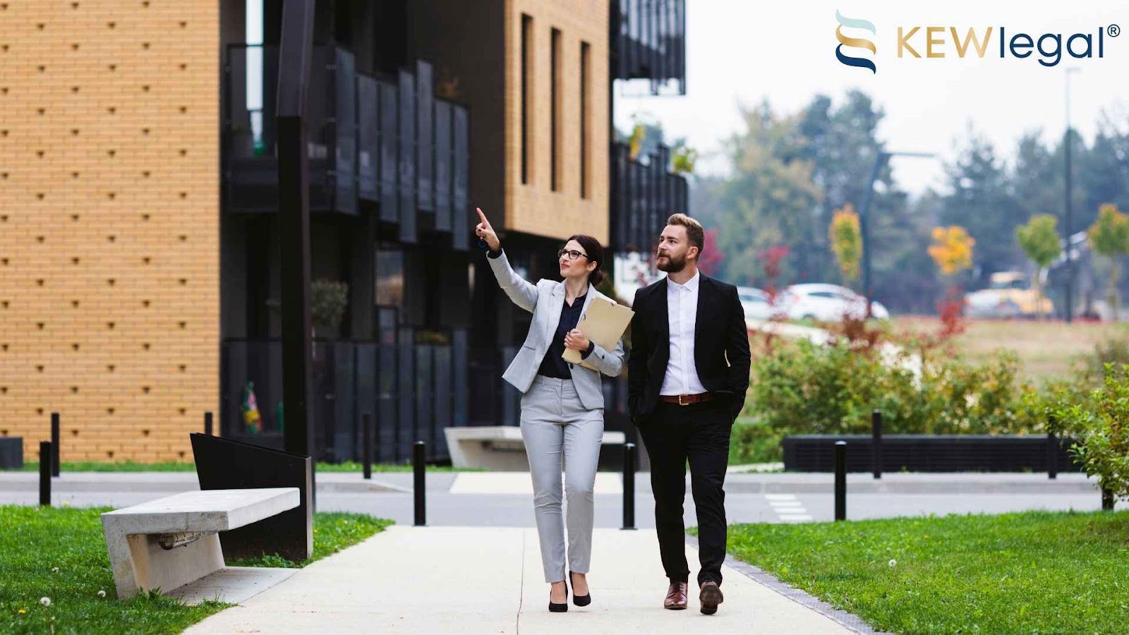 Business professionals walking and discussing outdoors.
