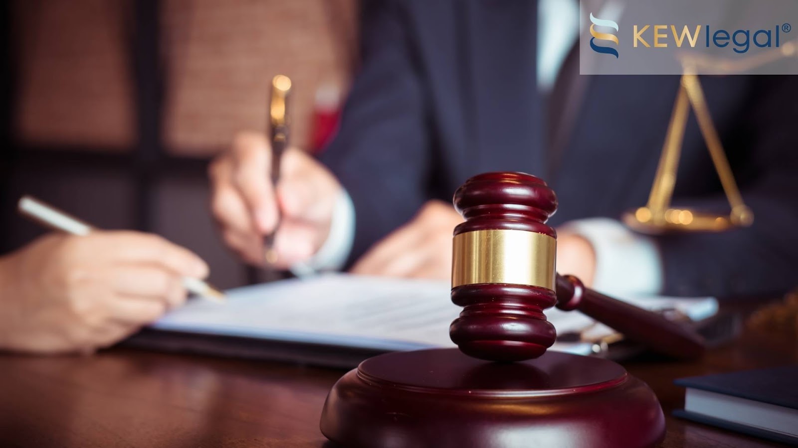 Legal documents and gavel on desk.