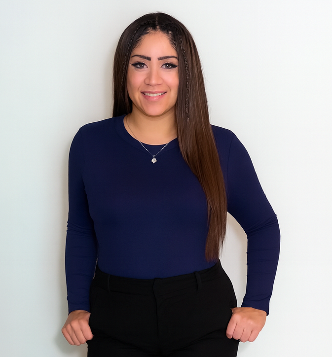 Smiling person in blue shirt and black pants