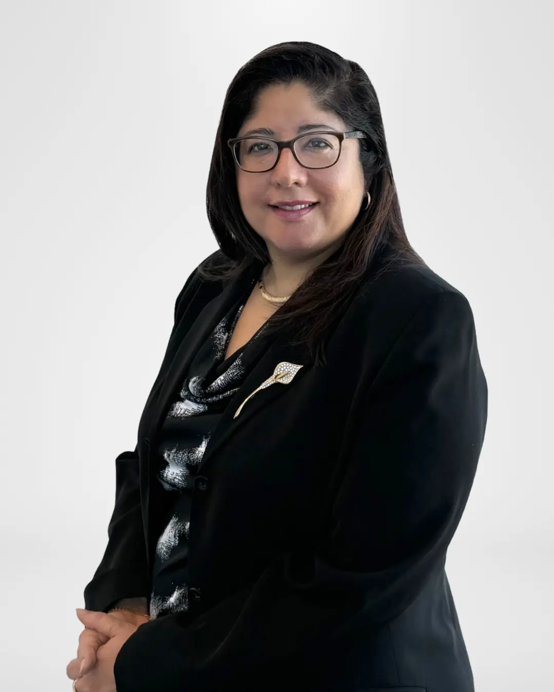 Professional woman wearing black suit and glasses