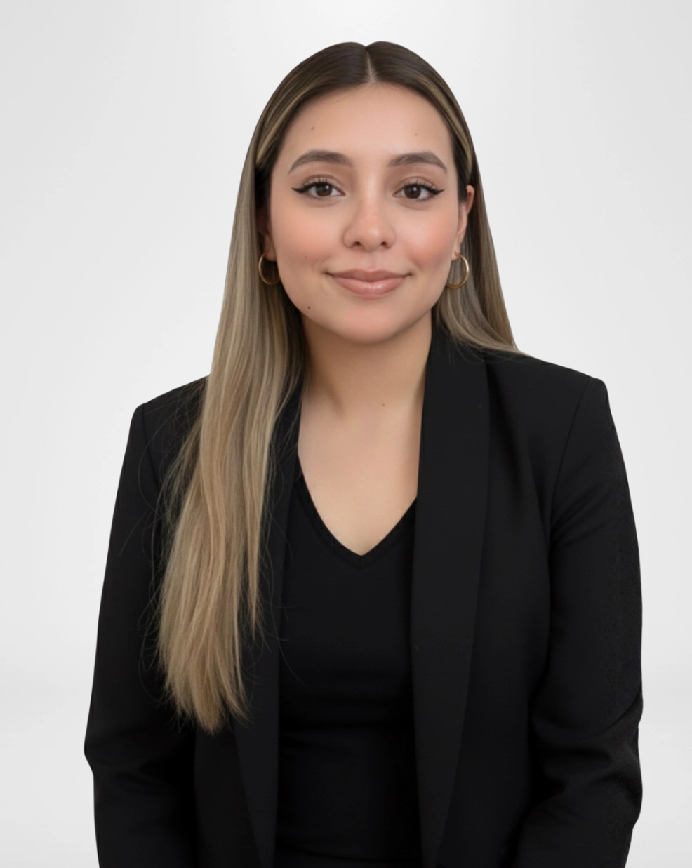 Professional woman smiling in black blazer portrait