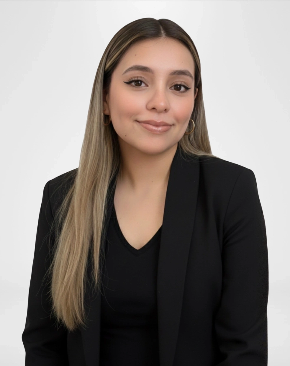 Professional woman in black blazer smiling